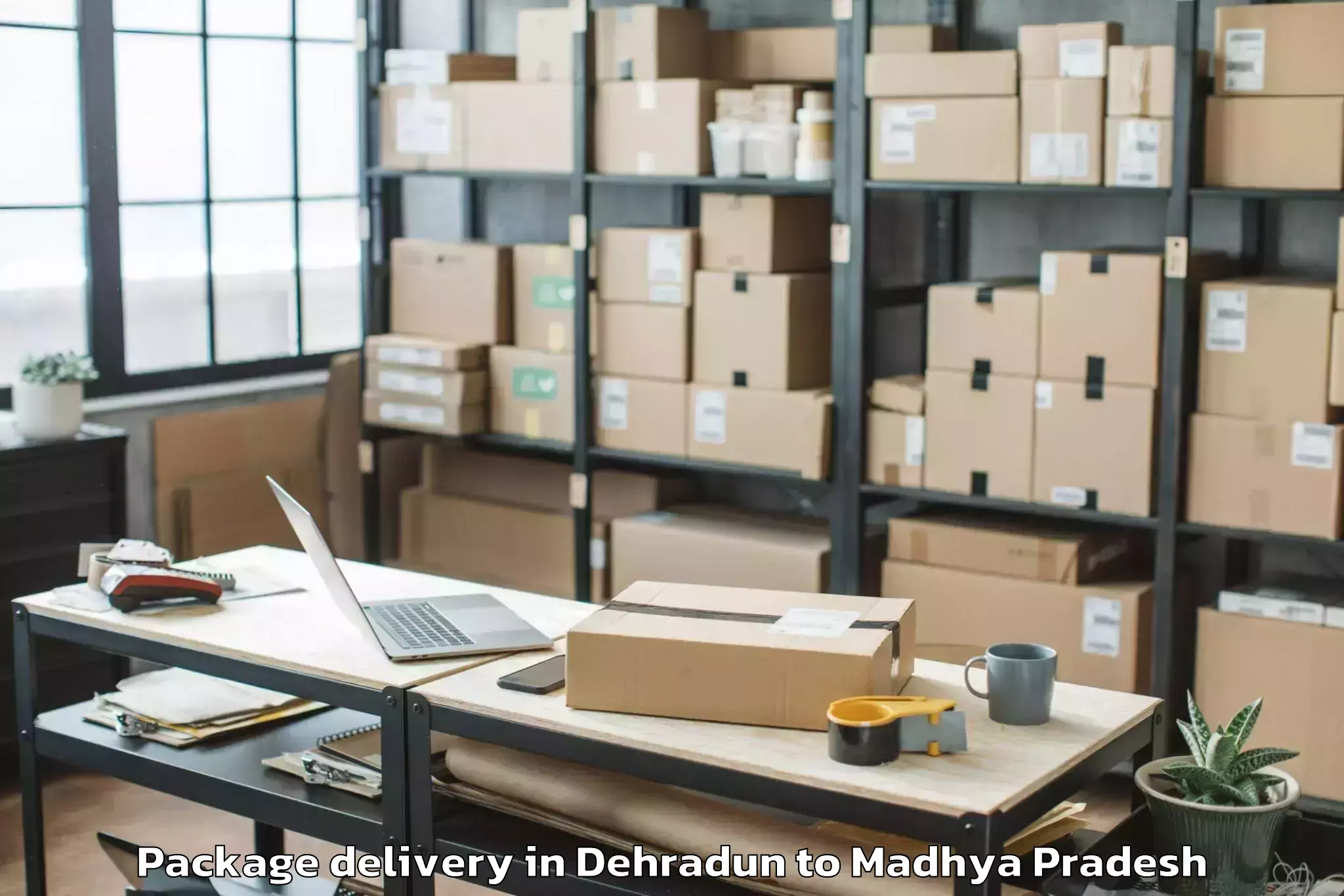 Book Dehradun to Makhanlal Chaturvedi Rashtriya Package Delivery Online